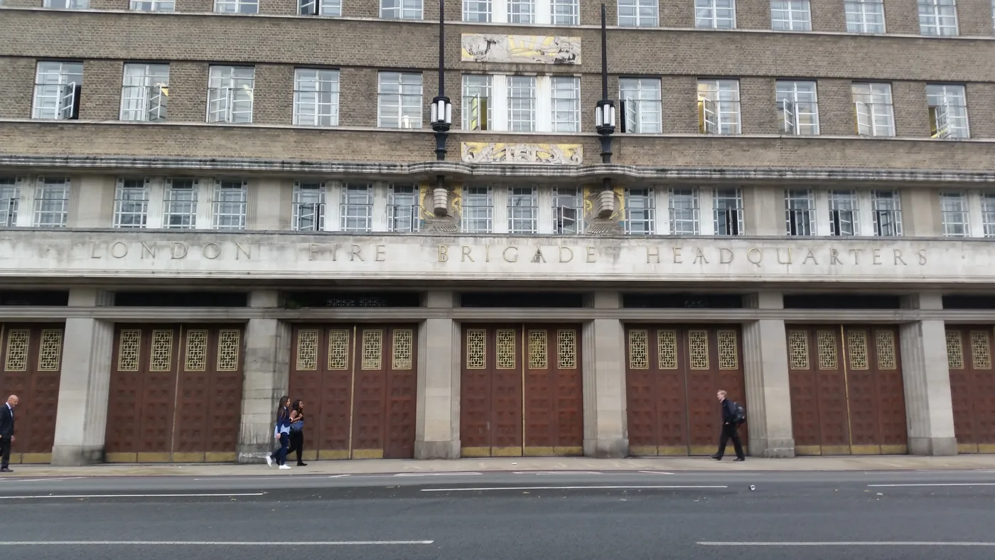 Lambeth fire station on Albert Embankment, with the old London Fire Brigade Headquarters lettering above the appliance bay doors.