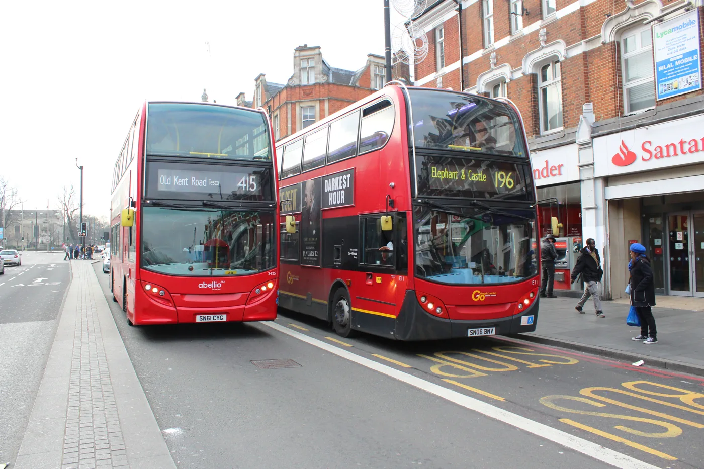A route 415 bus bound for Old Kent Road (Tesco) at the stops on Brixton Road, with a 196 to Elephant and Castle behind it.